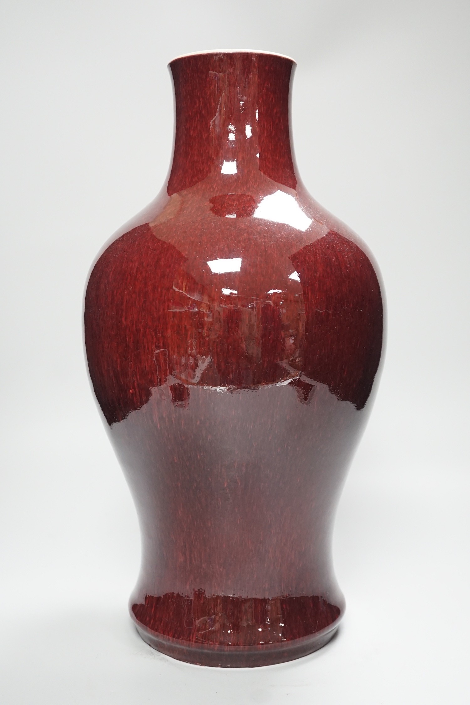 A 19th century Chinese sang de boeuf vase, neck cut down, 36.5cms high